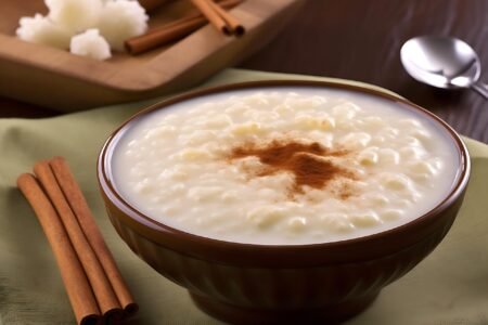 artisanal food and drink, bowl, brazil, brazilian culture, brazilian food, cinnamon, corn, cornish pasty, cultures, curau, food, food and drink, green color, homemade, hominy, lifestyles, local landmark, porridge, rural scene, rustic, stingray, ai generated