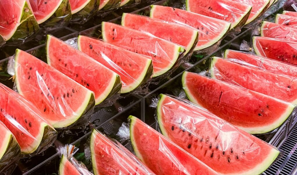 sliced watermelon on stainless steel tray