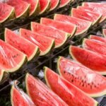 Você conhece os superpoderes da melancia? sliced watermelon on stainless steel tray