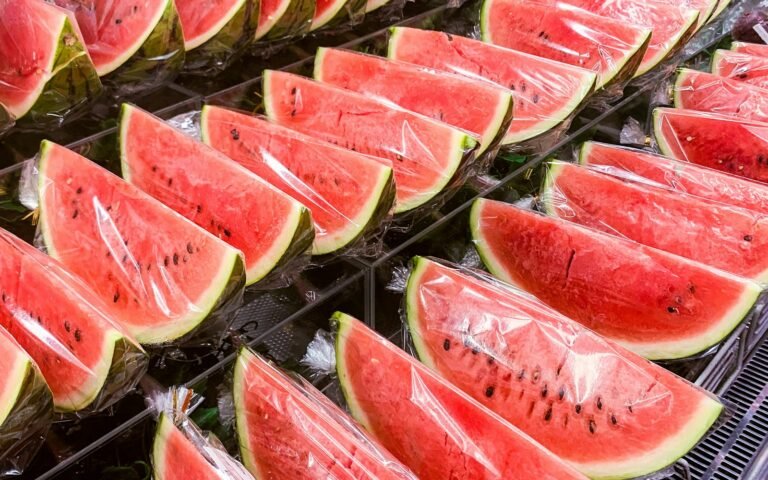 sliced watermelon on stainless steel tray
