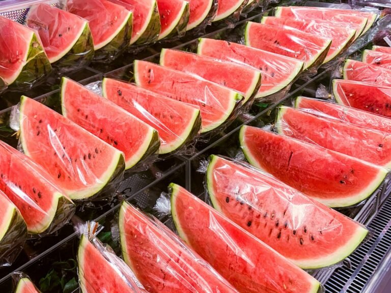 sliced watermelon on stainless steel tray