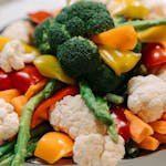 A vibrant assortment of fresh vegetables including broccoli, asparagus, and bell peppers.