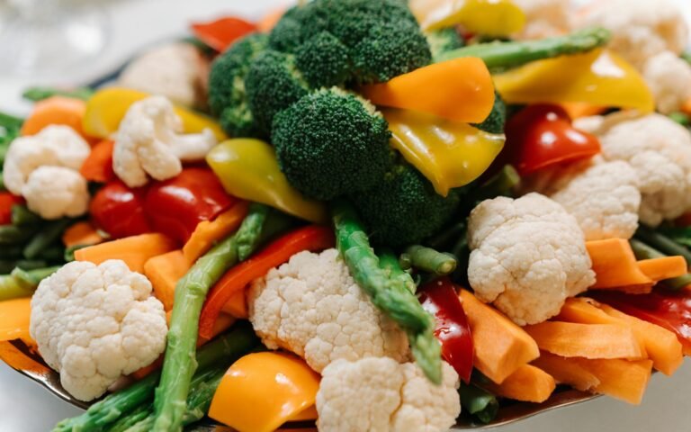 A vibrant assortment of fresh vegetables including broccoli, asparagus, and bell peppers.